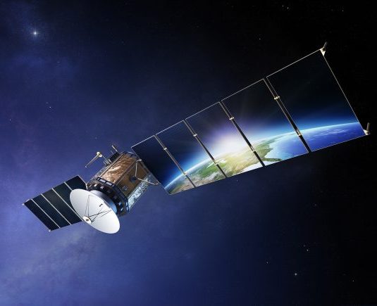 Communications satellite orbiting above Earth