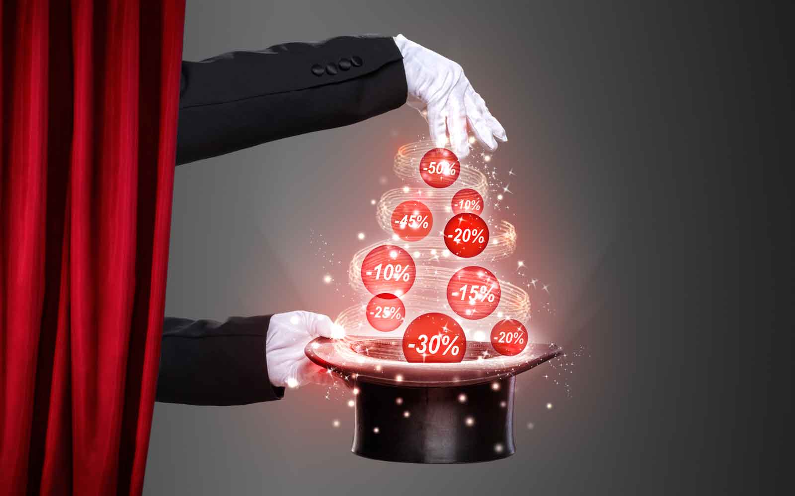 Stage magician presenting a collection of different percentage discounts above a hat