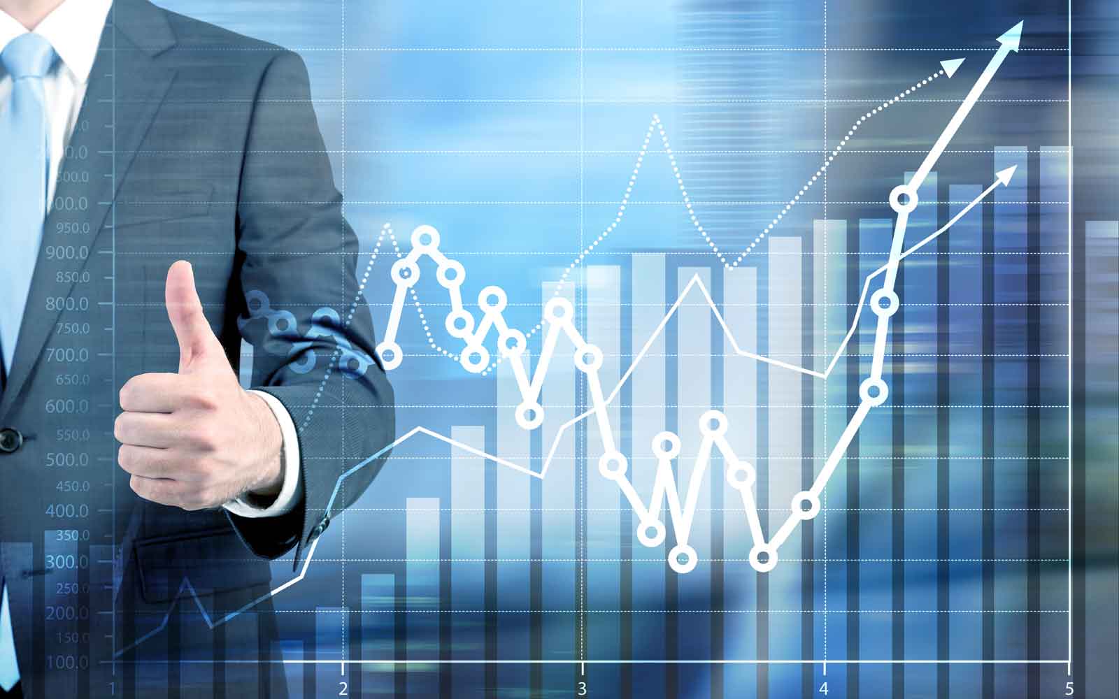 Businessperson giving a thumbs-up beside rising performance charts